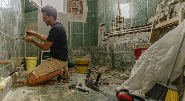 Man remodeling bathroom
